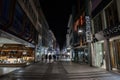 COLOGNE, GERMANY - NOVEMBER 6, 2022: Selective blur on Hohe Strasse street at night, with shops and stores closed, empty and Royalty Free Stock Photo